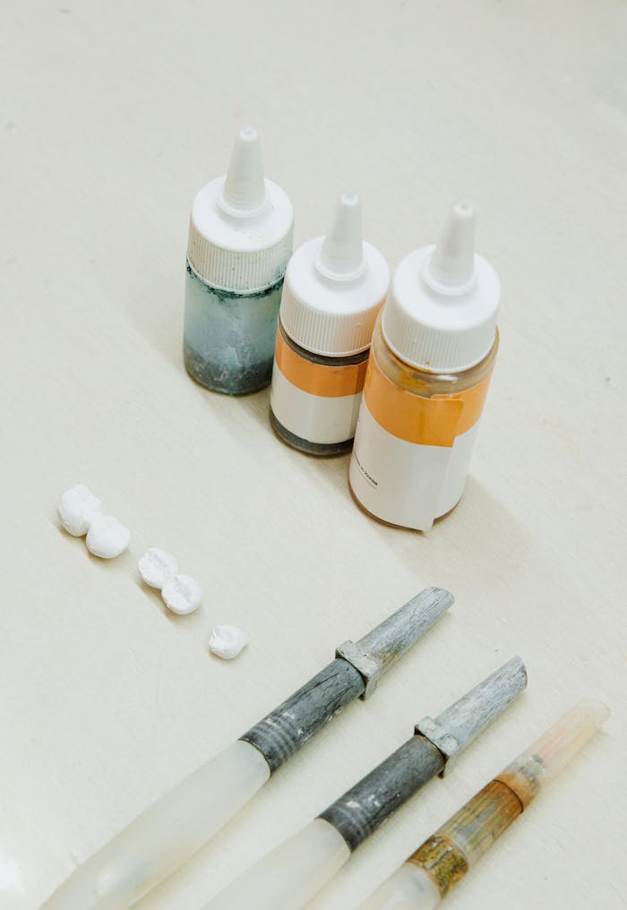 gallery-1 A high-angle view of dental laboratory tools and materials on a clean white surface.