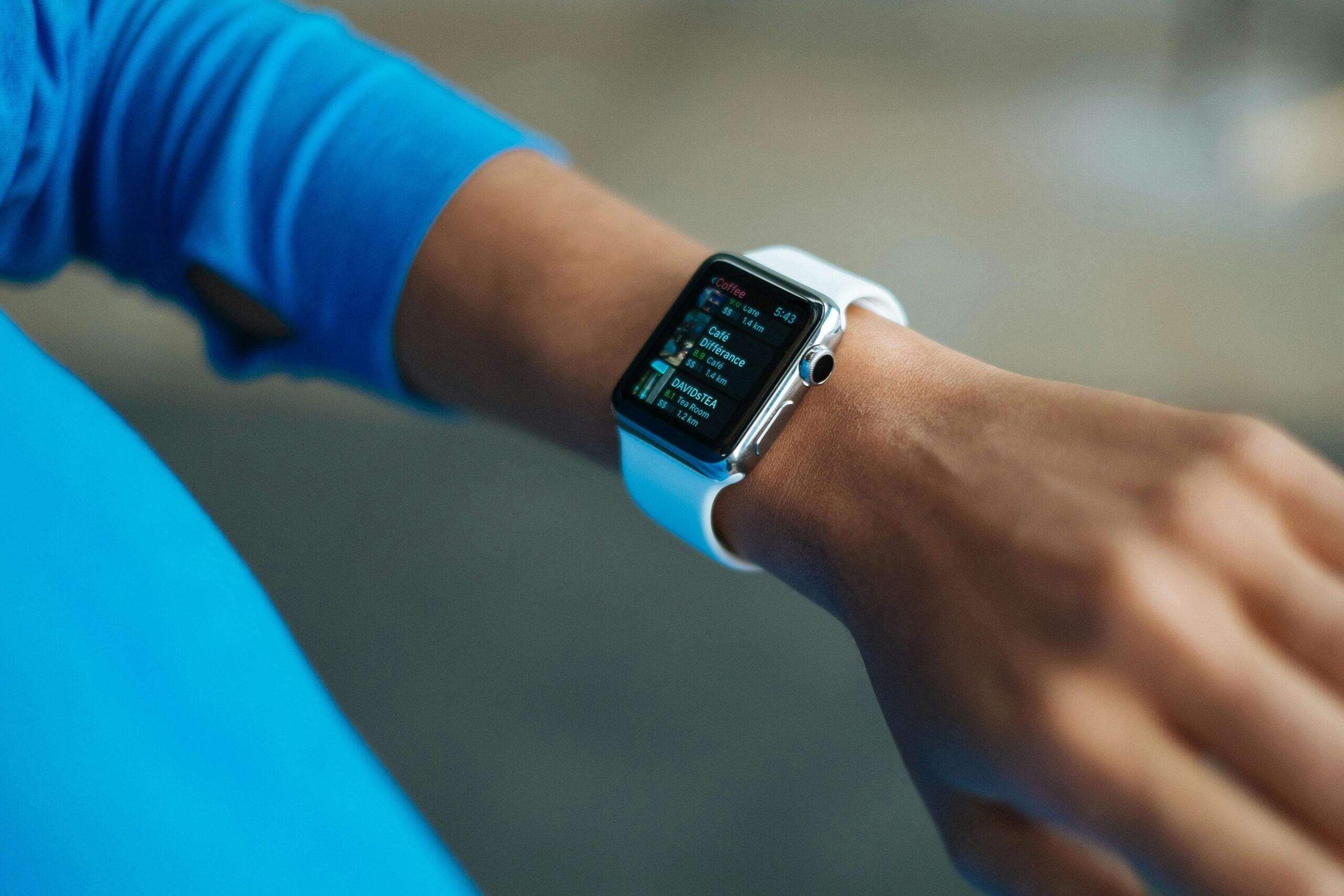Your Patients Are Generating Mountains of Health Data — But You Can’t Use It. Here’s How FHIR Fixes That. Focus on a smartwatch worn on an adult's wrist, showcasing its digital display.